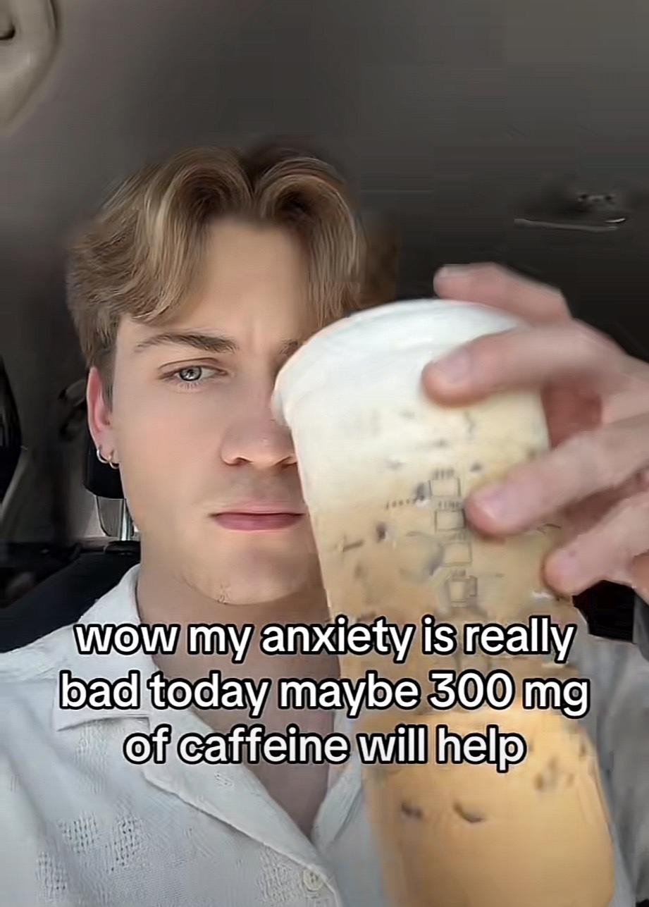 Photo of a person holding a large iced coffee with the caption ”wow my anxiety is really bad today maybe 300 mg of caffeine will help”