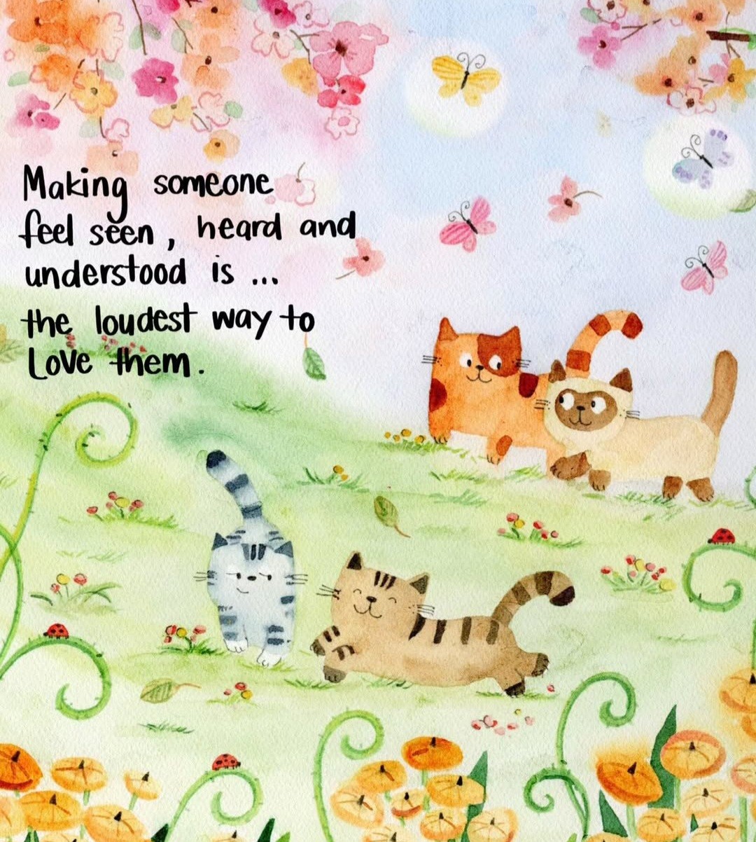 Watercolour of smiling cats playing in a field with flowers says "making someone feel seen heard and understood is the loudest way to love them" 